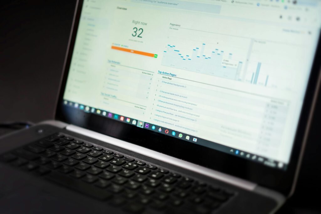 Scalenut SEO dashboard on a laptop showing a content strategy roadmap, keyword cluster performance charts, and real-time organic traffic growth analytics.