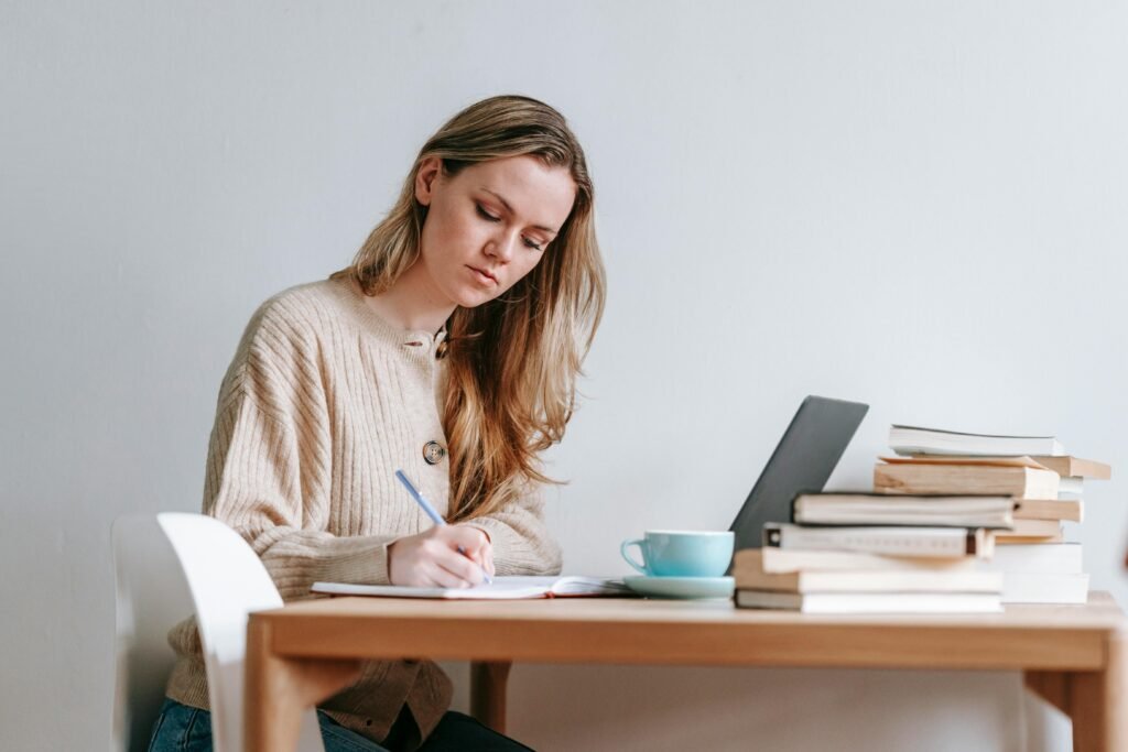 Student writing a thesis using Paperpal AI editing tool for academic writing.